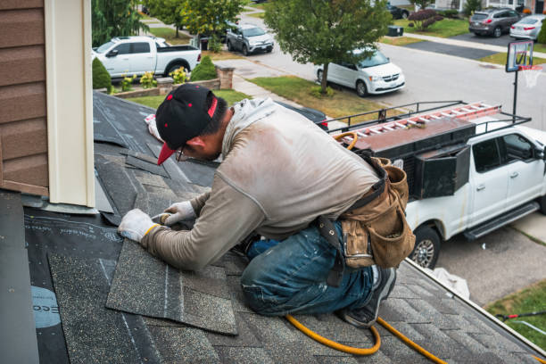 Professional Roofing technician working in Harlan, IN